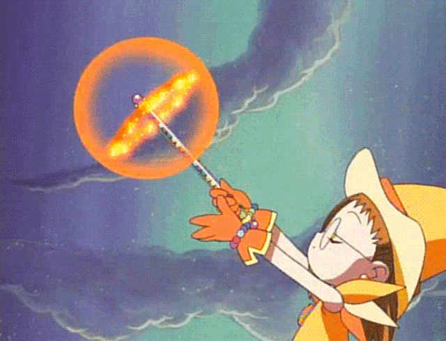a girl in a yellow hat is blowing a bubble with a magic wand