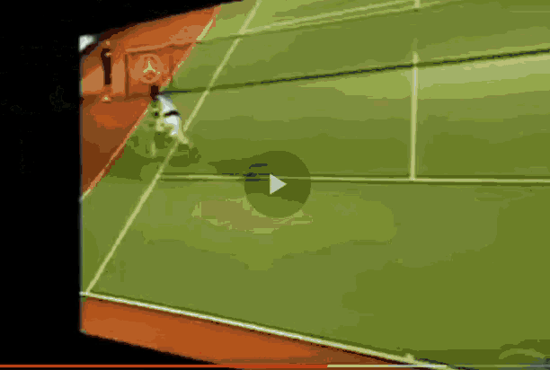 a tennis match is being played on a court with a crowd watching
