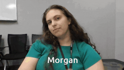 a woman in a green shirt with the name morgan on her shirt
