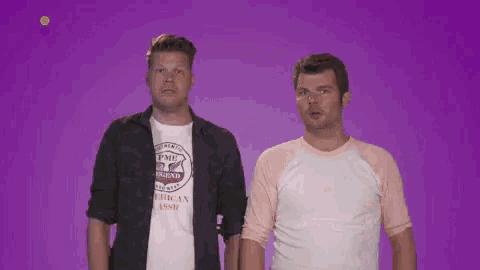 two men are standing next to each other with one wearing a shirt that says pmd legend