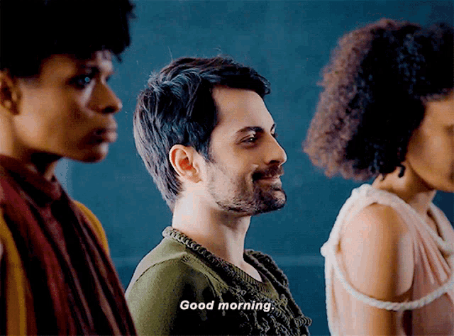 a man in a green sweater says " good morning "