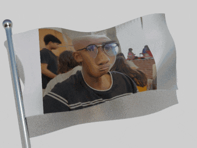 a flag with a picture of a man wearing glasses on it