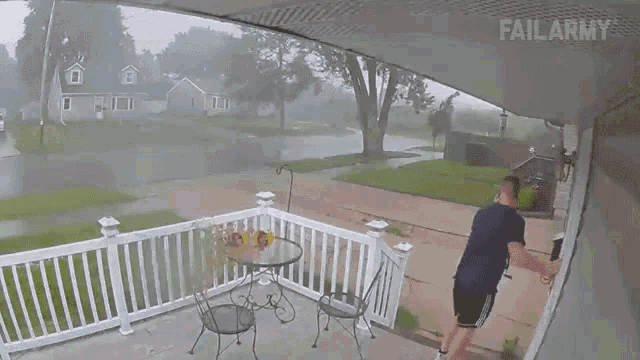 a man stands on a porch in the rain with failarmy written on the bottom