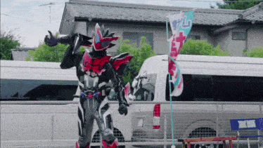 a man in a black and red costume is standing in front of a white van