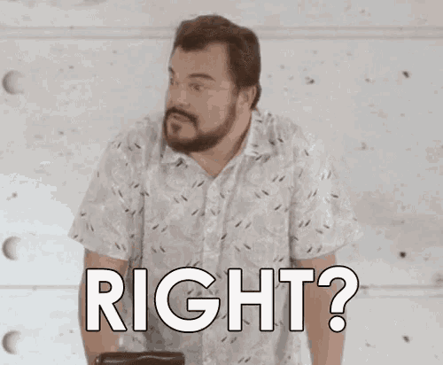 a man with a beard is standing in front of a wall and asking , `` right ? ''
