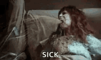 a woman is laying in a hospital bed with a sick expression on her face and mouth .