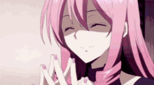 a girl with pink hair and purple nails is smiling and making a peace sign with her hands .