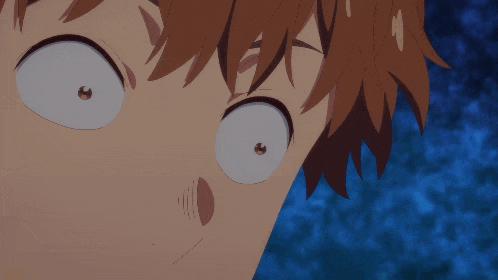 a close up of a person 's face with a surprised look on his face