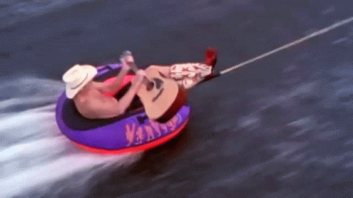 Paddling With A Guitar Alan Jackson GIF - Paddling With A Guitar Alan Jackson Chattahoochee Song GIFs