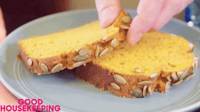 a slice of bread with pumpkin seeds on it is on a plate with the words good housekeeping written on it