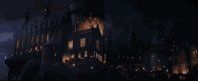a dark castle with a lot of lights on