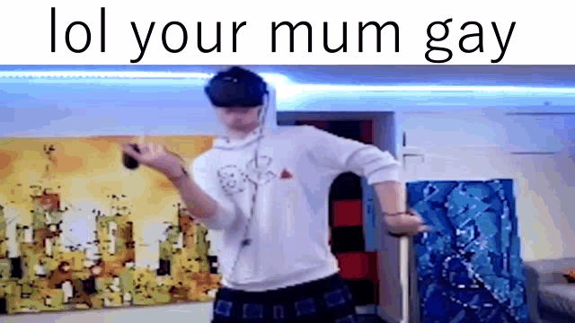 a man wearing a virtual reality headset is dancing in front of a painting in a room .