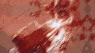 a blurred image of a person 's torso with a red background