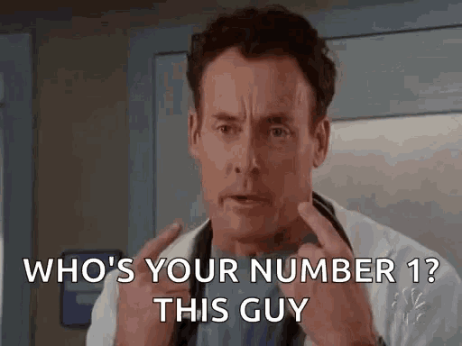 a man in a doctor 's coat is asking who 's your number ? this guy .