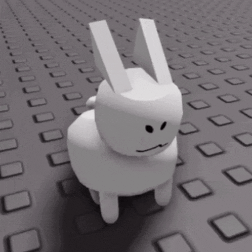 a white bunny with a sad face is walking on a gray surface .