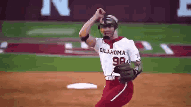 a baseball player wearing an oklahoma jersey is standing on the field