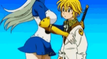 a boy and a girl are standing next to each other .