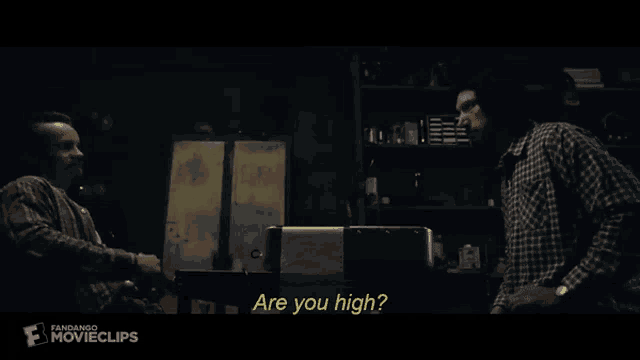 two men are talking in a dark room and one of them is asking the other if he is high