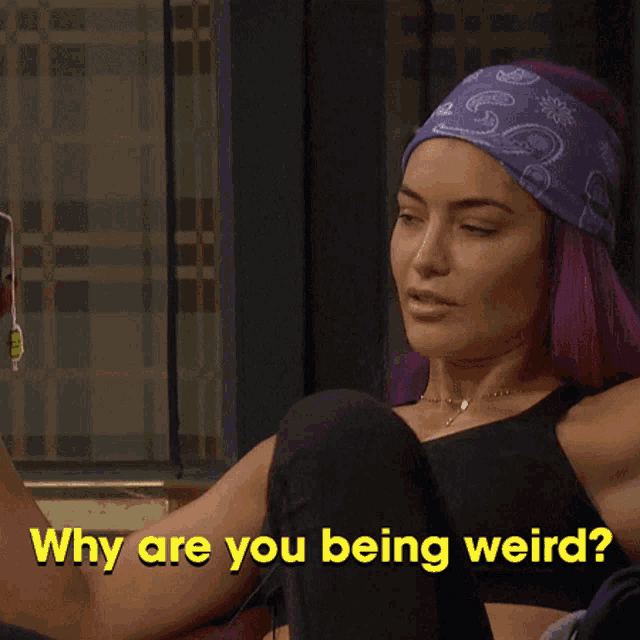 a woman with purple hair and a bandana on her head is asking why are you being weird