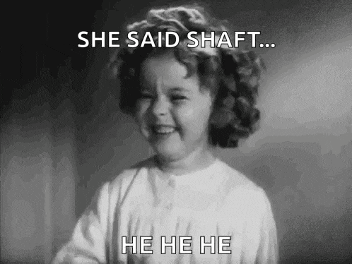 a little girl is laughing in a black and white photo .