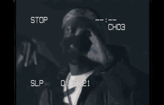 a video of a man taking a picture with the words stop slp and ch03 visible