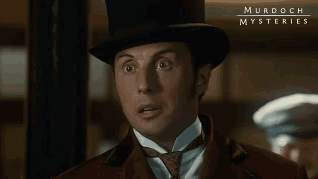 a man wearing a top hat and a suit is featured in murdoch mysteries