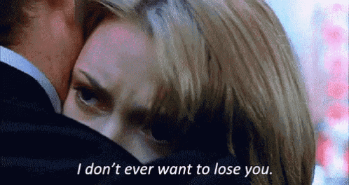 a man and a woman are hugging each other and the woman is saying `` i don 't ever want to lose you ''
