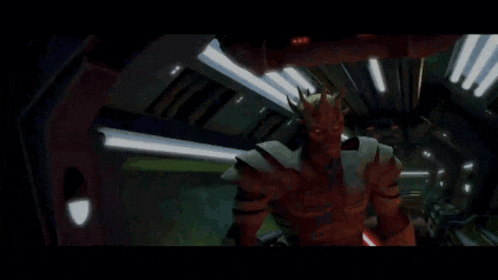 a red monster with horns is holding a red lightsaber in a dark room
