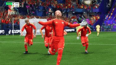a group of soccer players are running on a field