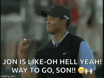 a man wearing a hat and a vest is holding a golf ball and making a fist in the air .