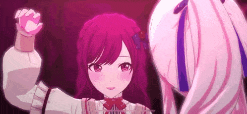 a close up of two anime girls holding hands .