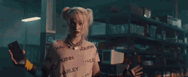 a woman in a suicide squad costume stands in a garage