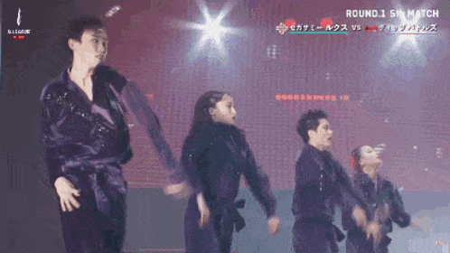 a group of people are dancing on a stage and the words round 1 5th match are on the bottom