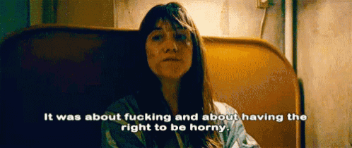 a woman with long hair is sitting in a chair and says it was about fucking and about having the right to be horny .