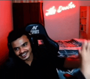 a man is sitting in a gaming chair with the word esports on it