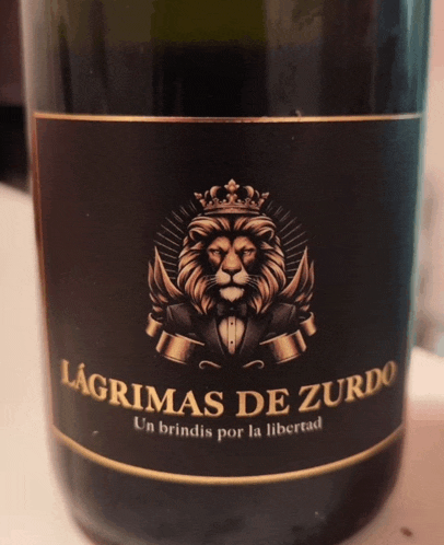 a bottle of lagrimas de zurdo has a lion with a crown on his head