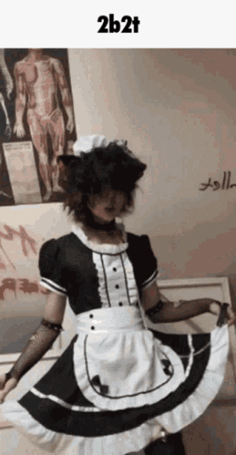 a person dressed in a maid costume with the words 2b2t written on the bottom