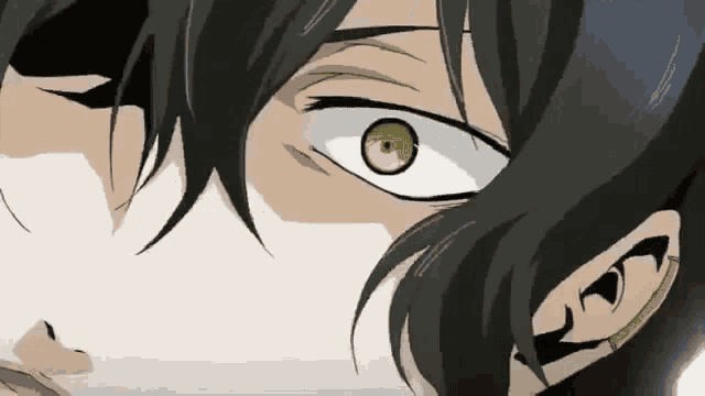 a close up of a person 's eye with green eyes