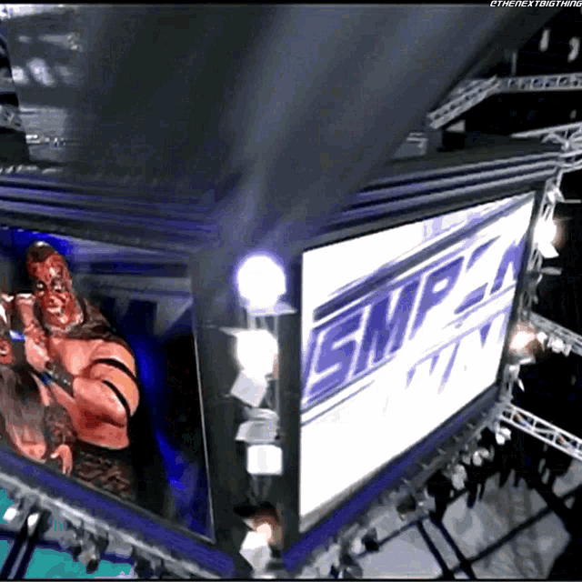 a large screen displays the word smp on it