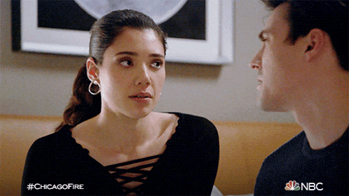 a man and a woman are looking at each other with the hashtag #chicagofire on the bottom
