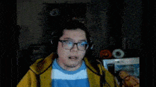 a man wearing glasses and headphones is looking at the camera