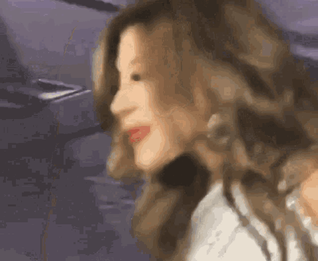 a close up of a woman 's face with long hair .