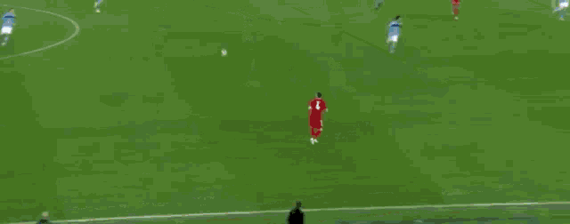a soccer game is being played on a field with equal game signs on the sidelines