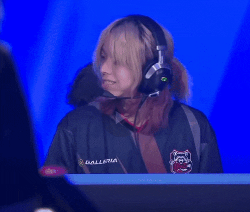 a woman wearing headphones and a galleria shirt