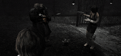 a man and a woman are fighting in a video game in a dark room .