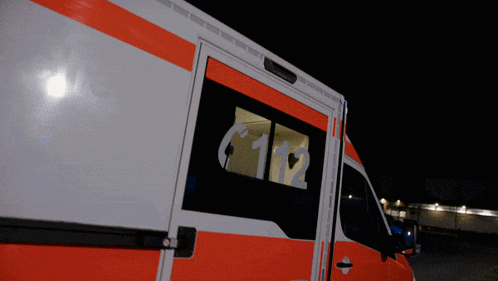 a red and white ambulance with the number 112 on it