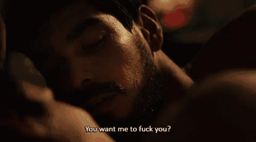 a man with a beard is laying on a woman 's lap and says " you want me to fuck you "