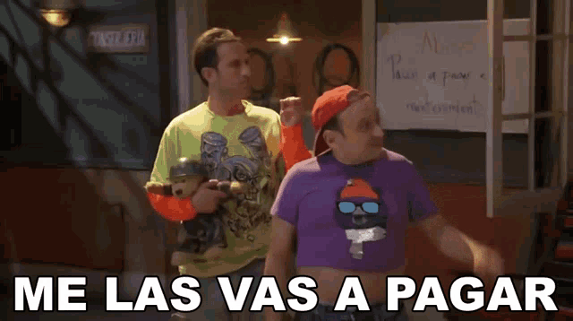 two men are standing in front of a sign that says " me las vas a pagar "