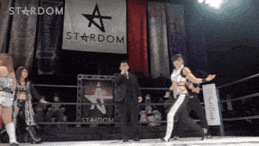 a wrestling ring with a sign that says stardom
