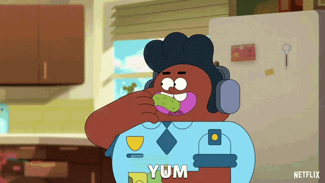 a cartoon character with headphones is eating something and the word yum is on his shirt